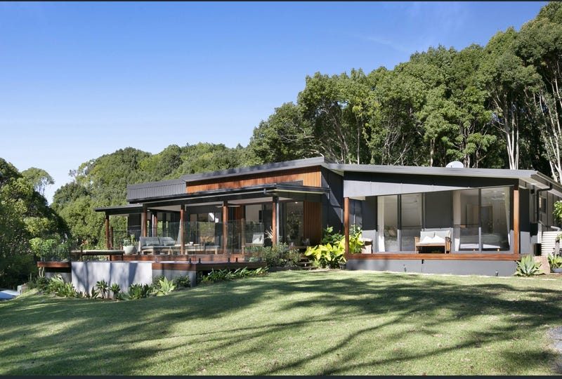 The house in Currumbin Valley where courses are taught, set on a lawn with forest behind